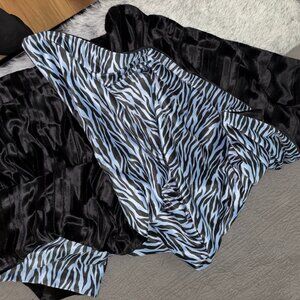 Black Mink Faux Fur throw with blue and black Snake patterned lining